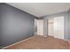 Cozy bedroom with neutral walls, carpet, and closet at 12305 W Flores Dr, El Mirage, AZ 85335