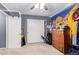 Bedroom with double door closet and ceiling fan at 12305 W Flores Dr, El Mirage, AZ 85335