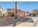 Two-story house with a large garage and desert landscaping at 12305 W Flores Dr, El Mirage, AZ 85335