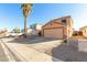 Two-story house with a large garage and desert landscaping at 12305 W Flores Dr, El Mirage, AZ 85335