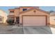 Two-story house with a large garage and desert landscaping at 12305 W Flores Dr, El Mirage, AZ 85335