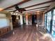 Bright living area featuring rustic barn doors and hardwood floors, with access to other rooms at 1232 E Mclellan Rd, Mesa, AZ 85203