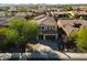 Aerial view of a beautiful home with a large yard and driveway at 13347 W Via Caballo Blanco --, Peoria, AZ 85383