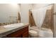 Bathroom with shower/tub combo, wood vanity, and tile flooring at 13347 W Via Caballo Blanco --, Peoria, AZ 85383