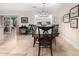 Dining room with a large wooden table and chandelier at 13438 W Ashwood Dr, Sun City West, AZ 85375