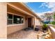 Brick paved porch with a bench and potted plants at 13438 W Ashwood Dr, Sun City West, AZ 85375