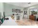 Bright home office with built-in shelving and desk at 13438 W Ashwood Dr, Sun City West, AZ 85375