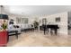 Living room featuring a gray sectional sofa and grand piano at 13438 W Ashwood Dr, Sun City West, AZ 85375