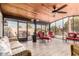 Sunroom with wicker furniture and a view of the backyard at 13438 W Ashwood Dr, Sun City West, AZ 85375