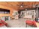 Relaxing sunroom featuring comfortable seating and a large TV at 13438 W Ashwood Dr, Sun City West, AZ 85375