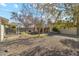 Spacious backyard with covered patio, gravel landscaping, and mature trees at 1374 W 16Th St, Tempe, AZ 85281