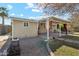 Covered patio with red curtains and gravel landscaping at 1374 W 16Th St, Tempe, AZ 85281