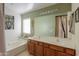 Bathroom with double vanity and soaking tub at 1406 S Navajo Ln, Coolidge, AZ 85128