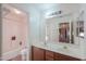 Bathroom with double vanity, bathtub, and toilet at 1406 S Navajo Ln, Coolidge, AZ 85128