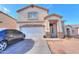 Two-story house with attached garage and landscaping at 1406 S Navajo Ln, Coolidge, AZ 85128