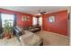 L-shaped sofa in a Gathering room with red walls at 1406 S Navajo Ln, Coolidge, AZ 85128