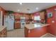 Kitchen with wood cabinets and an island at 1406 S Navajo Ln, Coolidge, AZ 85128