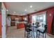 Kitchen with island, breakfast nook, and wood cabinets at 1406 S Navajo Ln, Coolidge, AZ 85128