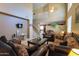 High ceiling living room, featuring a large window and staircase at 1406 S Navajo Ln, Coolidge, AZ 85128