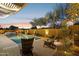 Relaxing pool and patio area with desert plants at 14501 N Lark Ct, Fountain Hills, AZ 85268