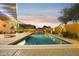 Inviting rectangular pool with a waterfall feature and surrounding patio at 14501 N Lark Ct, Fountain Hills, AZ 85268