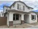 Charming two-story home featuring a white exterior, decorative shutters, and a welcoming front porch, perfect for a Gathering at 14652 W Sand Hills Rd, Surprise, AZ 85387