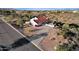 Aerial view of a house with a red tile roof and a long driveway at 16544 E Trevino Dr, Fountain Hills, AZ 85268