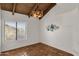 Bright bedroom with wood beamed ceiling and terracotta tile floors at 16544 E Trevino Dr, Fountain Hills, AZ 85268