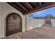 Private courtyard with tiled flooring, wooden door, and tiled accents at 16544 E Trevino Dr, Fountain Hills, AZ 85268