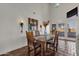 Spacious dining area with a rustic wooden table and high ceilings at 16544 E Trevino Dr, Fountain Hills, AZ 85268