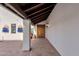 Covered entryway with arched wooden door and terracotta tile flooring at 16544 E Trevino Dr, Fountain Hills, AZ 85268