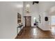 Bright entryway with tile flooring, a wood door and chandelier at 16544 E Trevino Dr, Fountain Hills, AZ 85268