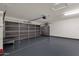 Spacious garage with dark gray floor and overhead storage at 16544 E Trevino Dr, Fountain Hills, AZ 85268