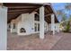 Covered patio with tile flooring and a built-in fireplace at 16544 E Trevino Dr, Fountain Hills, AZ 85268