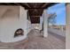 Covered patio with fireplace and mountain views at 16544 E Trevino Dr, Fountain Hills, AZ 85268