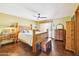 Spacious bedroom with a wooden bed frame and built-in wooden dresser at 17203 E Calaveras Ave, Fountain Hills, AZ 85268