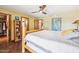 Bright bedroom with a wooden bed frame and a walk-in closet at 17203 E Calaveras Ave, Fountain Hills, AZ 85268