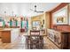 Bright dining area with wooden table and chairs, adjacent to the kitchen at 17203 E Calaveras Ave, Fountain Hills, AZ 85268