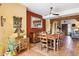 Rustic dining area with wooden table and access to living room at 17203 E Calaveras Ave, Fountain Hills, AZ 85268