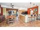 Large kitchen with breakfast bar, island, and access to living area at 17203 E Calaveras Ave, Fountain Hills, AZ 85268