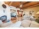 Living room with wood beam ceilings and fireplace at 17203 E Calaveras Ave, Fountain Hills, AZ 85268