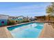 Inviting pool area with a painted wall and patio seating at 17203 E Calaveras Ave, Fountain Hills, AZ 85268