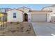 One-story home with a two-car garage and desert landscaping at 18067 W Camino De Oro --, Surprise, AZ 85387