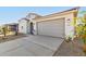 New construction home with a two-car garage and driveway at 18067 W Camino De Oro --, Surprise, AZ 85387