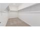 Large walk-in closet with double hanging rods and carpeted floor at 18067 W Camino De Oro --, Surprise, AZ 85387