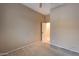 Simple bedroom with carpeted floor and door to bathroom at 18473 W Piedmont Rd, Goodyear, AZ 85338