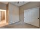 Spacious bedroom with double-door closet and adjacent hallway at 18473 W Piedmont Rd, Goodyear, AZ 85338