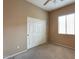 Bedroom featuring a window with blinds and double-door closet at 18473 W Piedmont Rd, Goodyear, AZ 85338