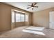 Bright bedroom featuring a bay window and ceiling fan at 18473 W Piedmont Rd, Goodyear, AZ 85338