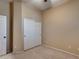 Well-lit bedroom with double door closet and carpet flooring at 18473 W Piedmont Rd, Goodyear, AZ 85338